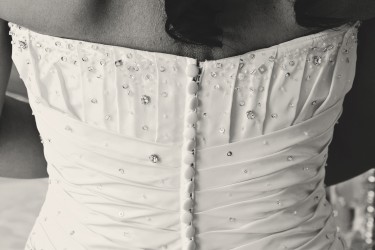 Close up of buttons down back of brides dress